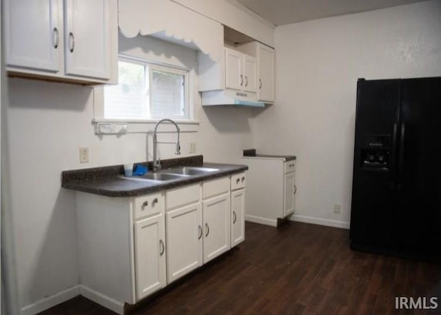 kitchen featuring sink, white cabinetry, black refrigerator with ice dispenser, and dark hardwood / wood-style flooring