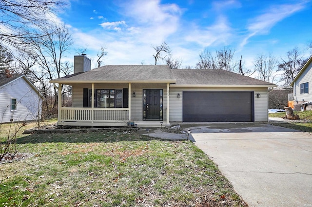 single story home featuring covered porch, a garage, and a front yard