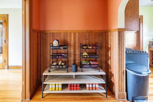 interior details with hardwood / wood-style floors and crown molding