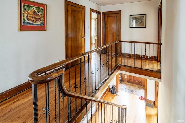 stairs featuring wood-type flooring