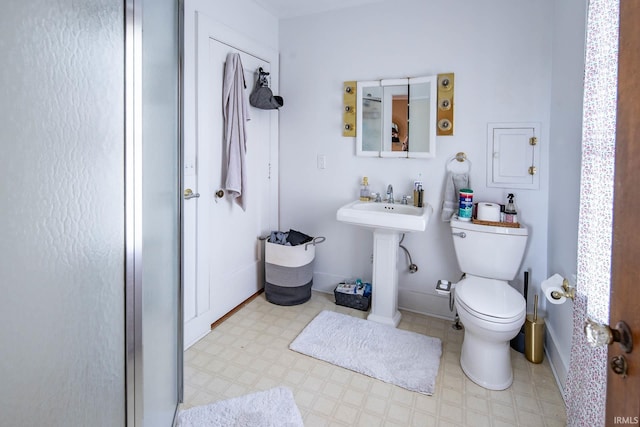 bathroom featuring sink and toilet