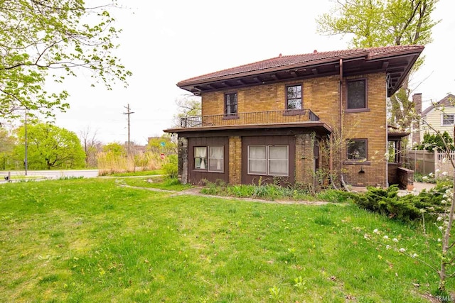 rear view of house with a lawn