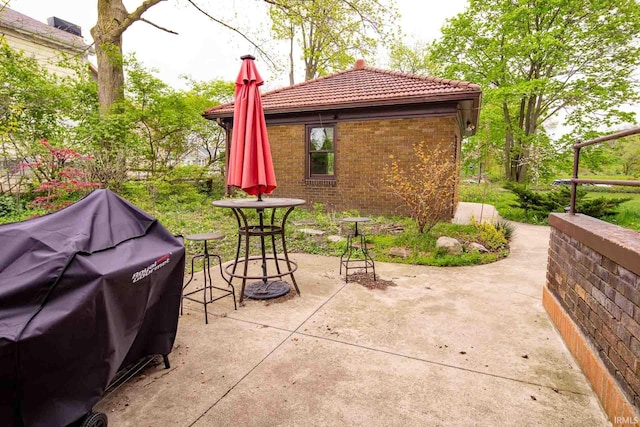 view of patio featuring a grill