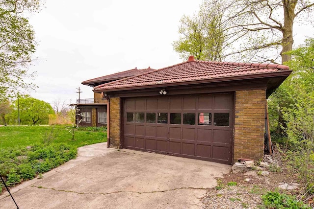 garage featuring a yard