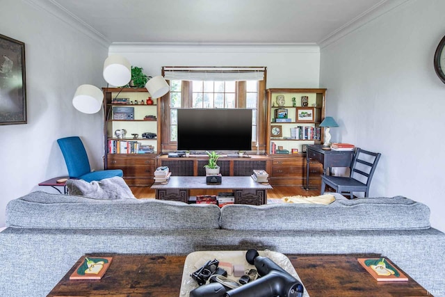 living room with hardwood / wood-style floors and crown molding