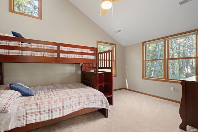 bedroom featuring ceiling fan, vaulted ceiling, and carpet floors