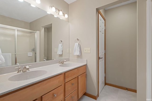 bathroom with toilet, walk in shower, vanity, and tile patterned floors