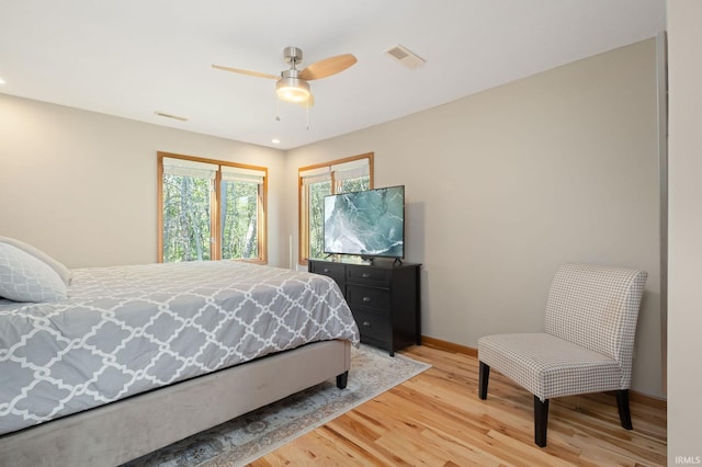 bedroom with light wood-type flooring and ceiling fan