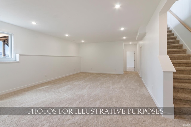 unfurnished room featuring light carpet