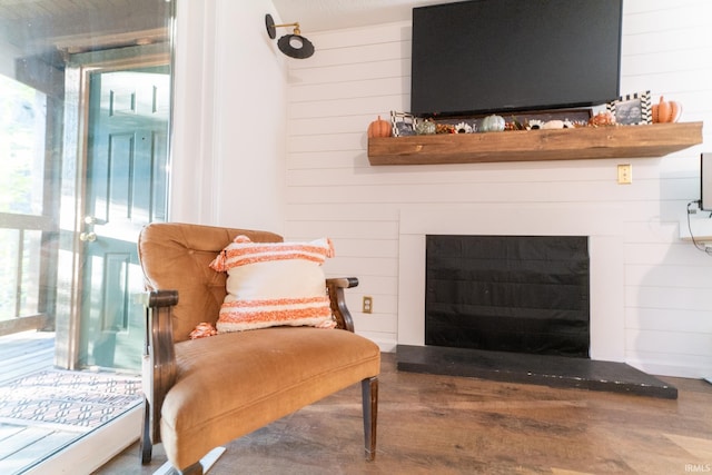 details featuring hardwood / wood-style floors and wooden walls