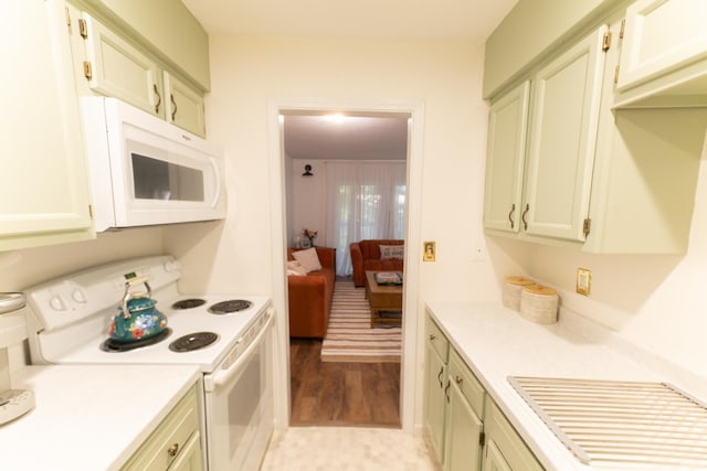 kitchen with white appliances and light wood-type flooring