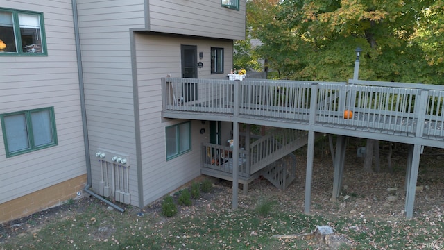 rear view of property featuring a deck