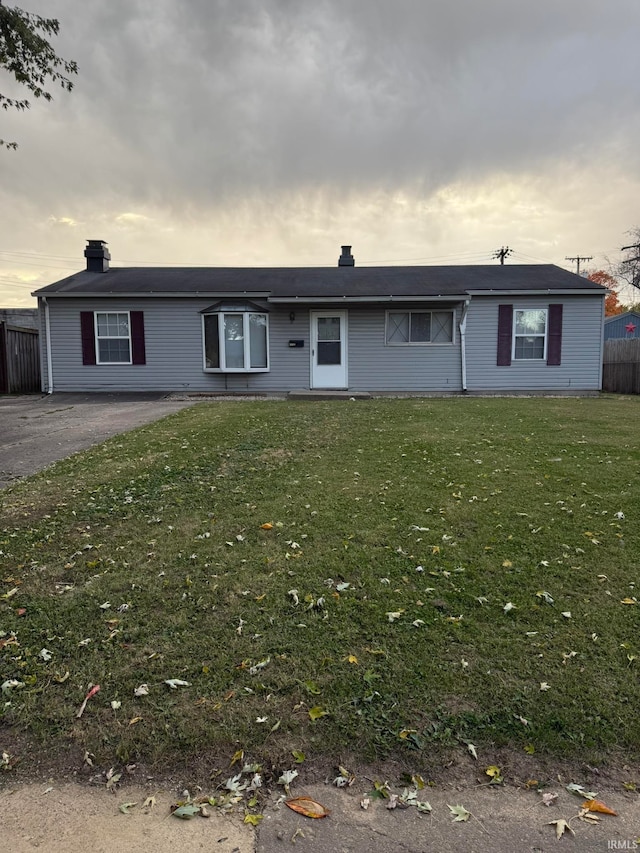 view of front of home with a lawn