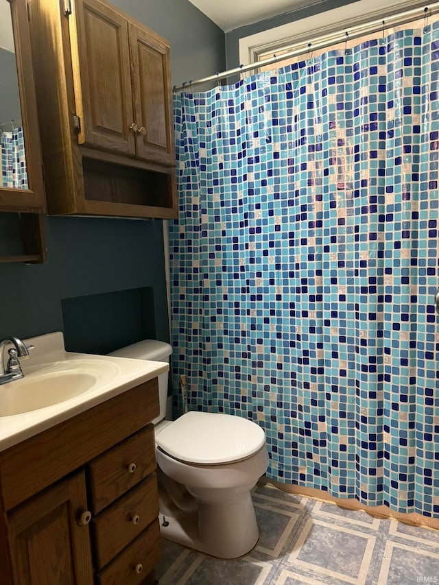 bathroom with vanity and toilet