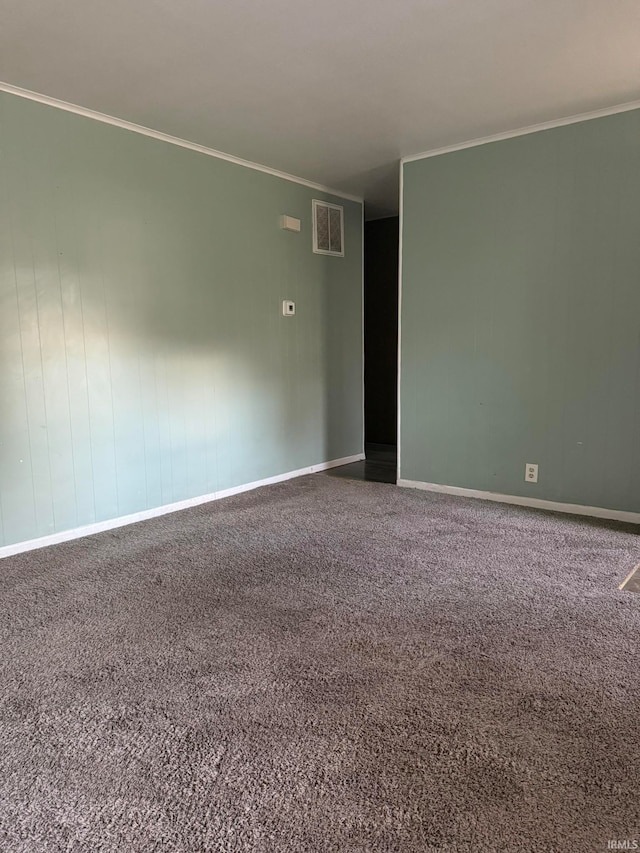 carpeted empty room with ornamental molding