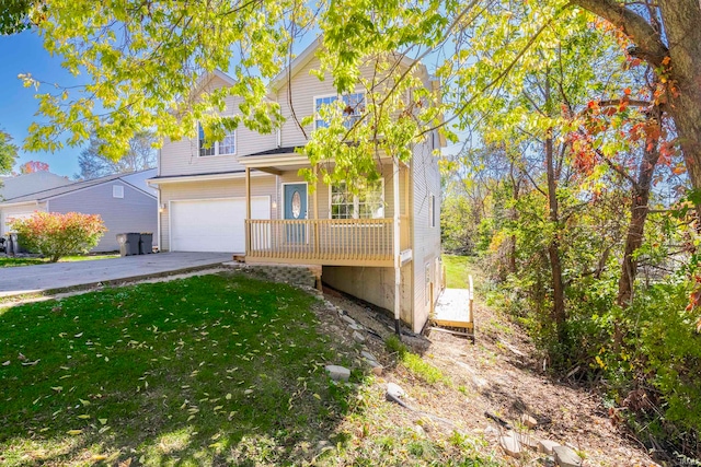 view of front property with a front yard and a garage