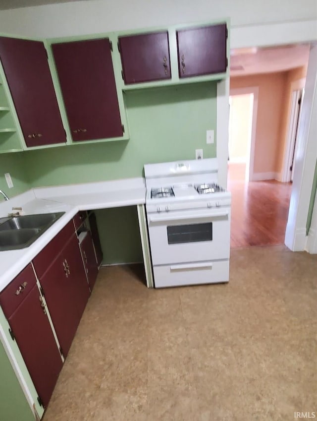 kitchen with sink and white stove