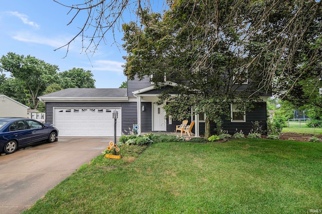 view of front of house featuring a front yard and a garage