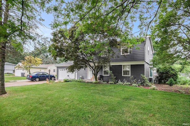 view of front of property with a front lawn and a garage