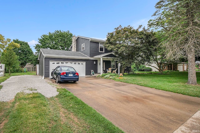 view of front of house with a garage and a front lawn