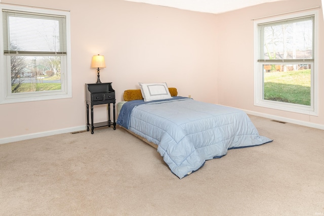 bedroom with light colored carpet