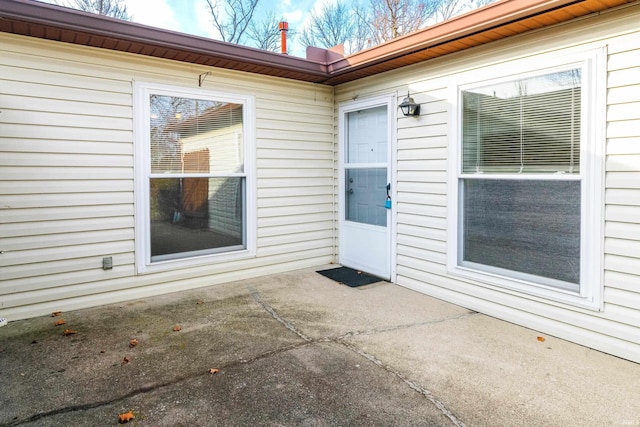 doorway to property with a patio