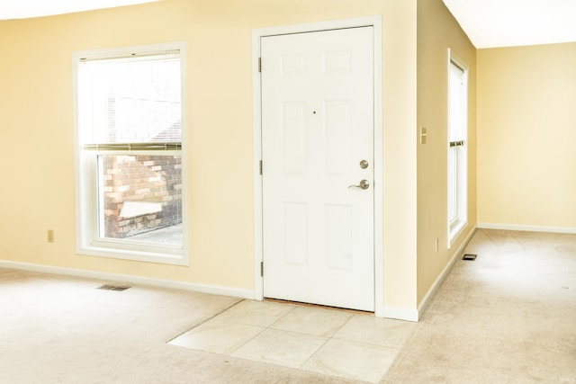 view of carpeted entrance foyer