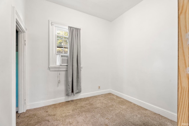 carpeted spare room featuring cooling unit