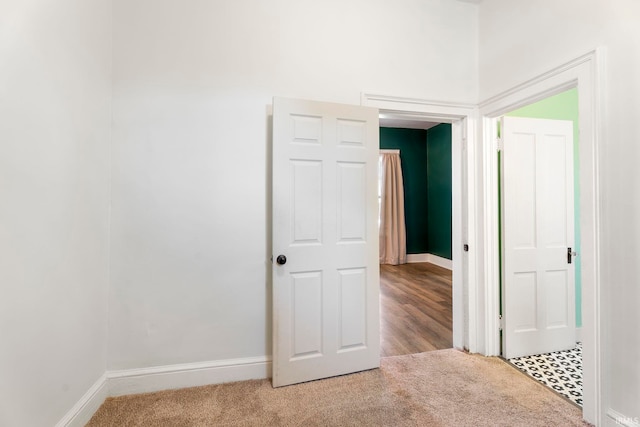 unfurnished bedroom featuring light colored carpet