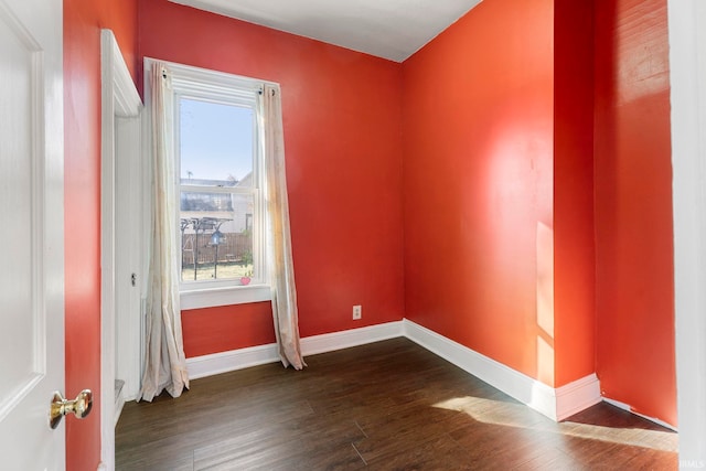 empty room featuring dark wood-type flooring