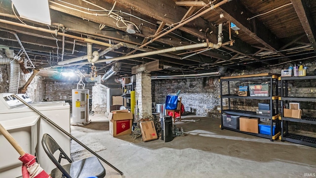 basement with electric water heater and separate washer and dryer