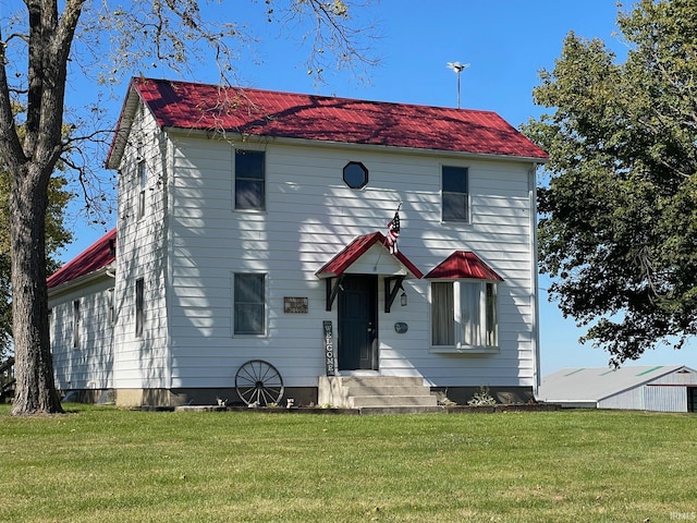 view of front of property featuring a front lawn