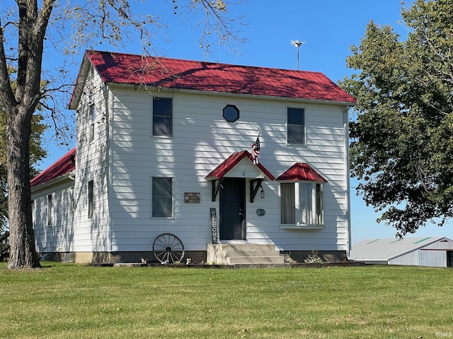 view of front of home featuring a front yard