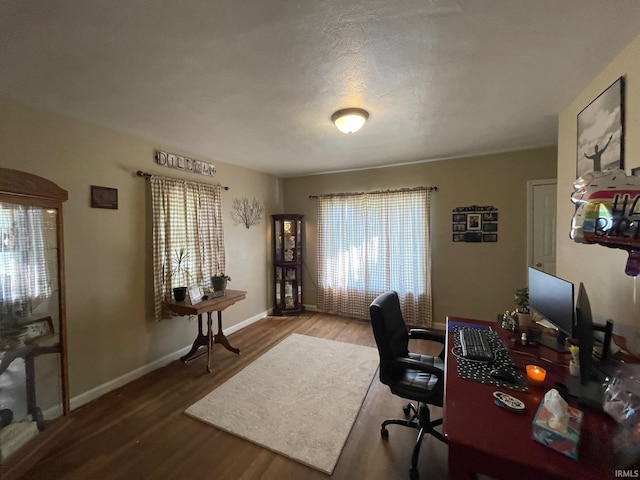 office space featuring hardwood / wood-style flooring and a textured ceiling