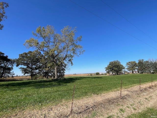 view of yard with a rural view