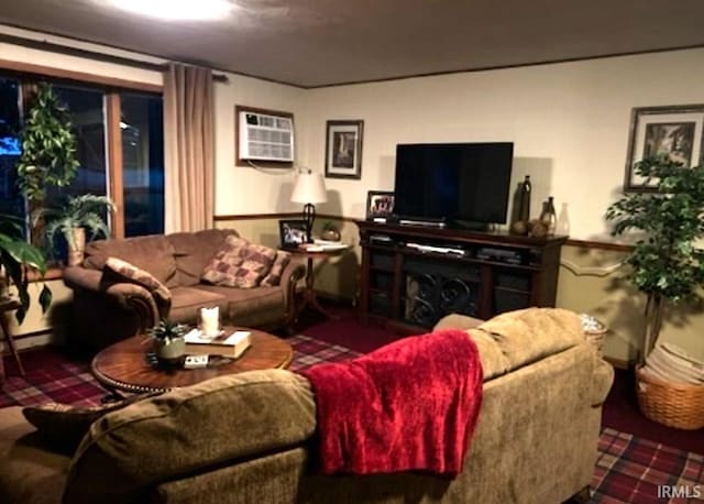 living room featuring carpet, a wall mounted AC, and a fireplace