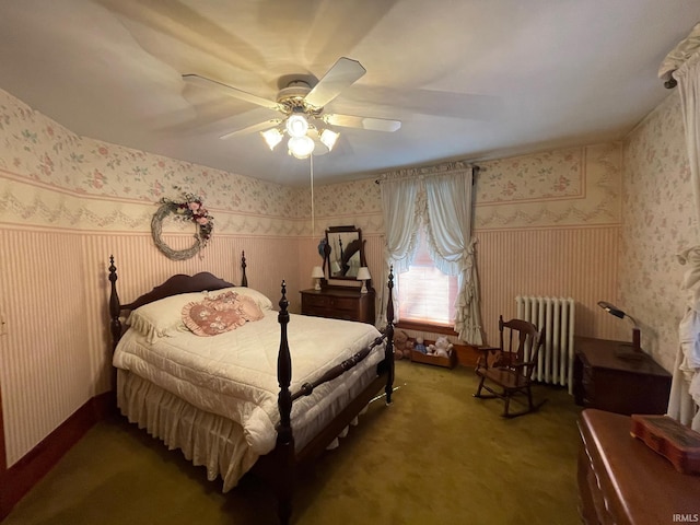 carpeted bedroom with radiator heating unit and ceiling fan