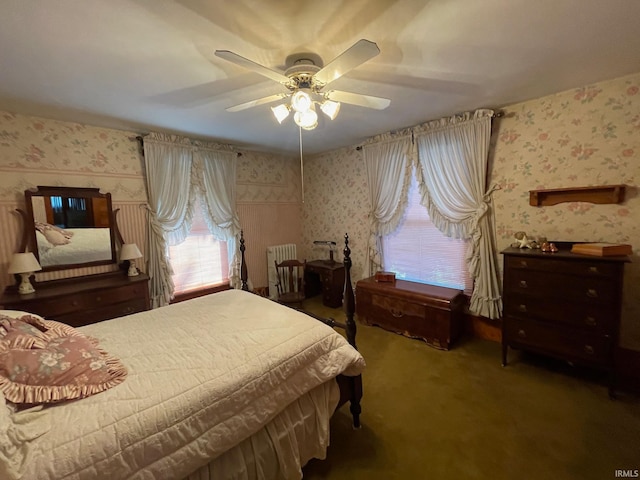 bedroom featuring carpet flooring, radiator heating unit, and ceiling fan