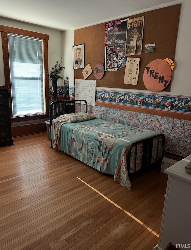 bedroom with wood-type flooring