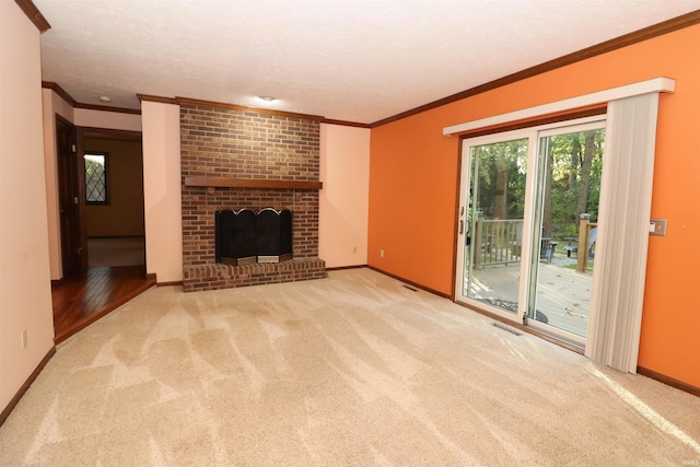 unfurnished living room featuring crown molding, light carpet, a textured ceiling, and a brick fireplace