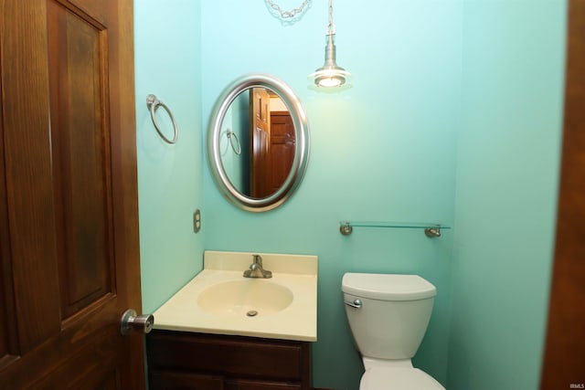 bathroom with toilet and vanity