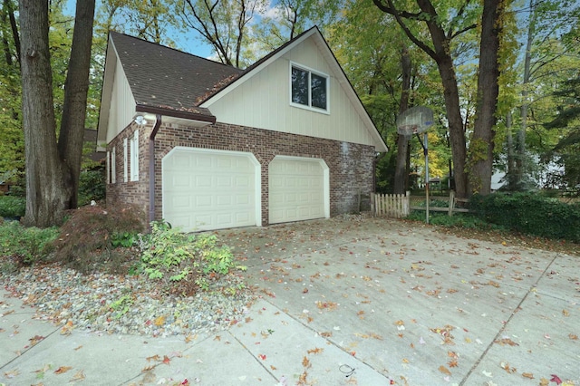 view of side of home featuring a garage