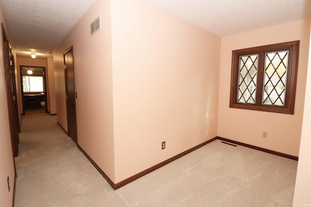 interior space featuring a textured ceiling