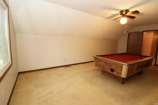 recreation room with ceiling fan, vaulted ceiling, light colored carpet, and billiards