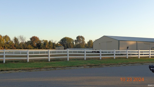 view of yard with a rural view