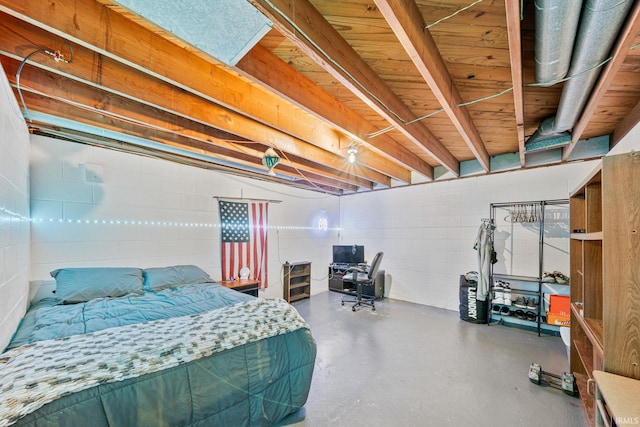 bedroom featuring concrete floors