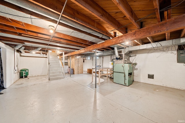 basement featuring washer / dryer, water heater, and heating unit