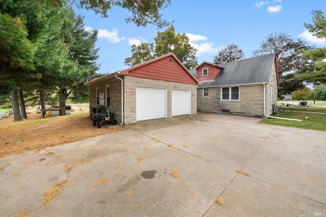 exterior space featuring an outbuilding and a garage