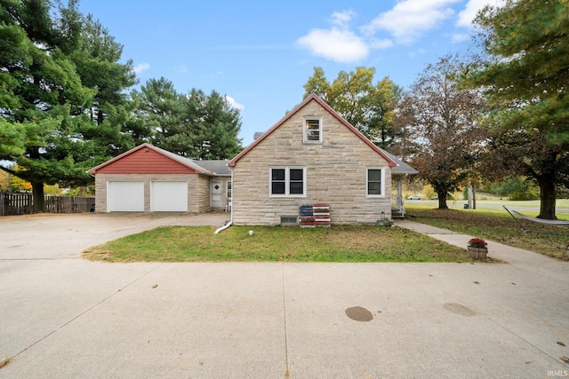 view of front of home with a front lawn and a garage