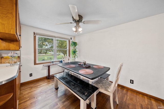 dining space featuring hardwood / wood-style flooring and ceiling fan